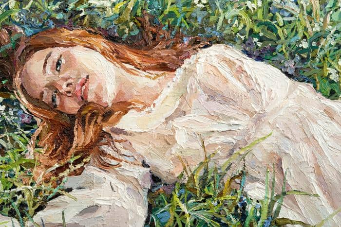 Obraz Na Płótnie .A Red-Haired Beauty, A Young Girl Lies And Dreams On The Field Among Various Summer Grasses And Wildflowers. Oil Painting On Canvas.